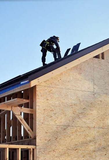OSB sheathing on a timber-frame house roof